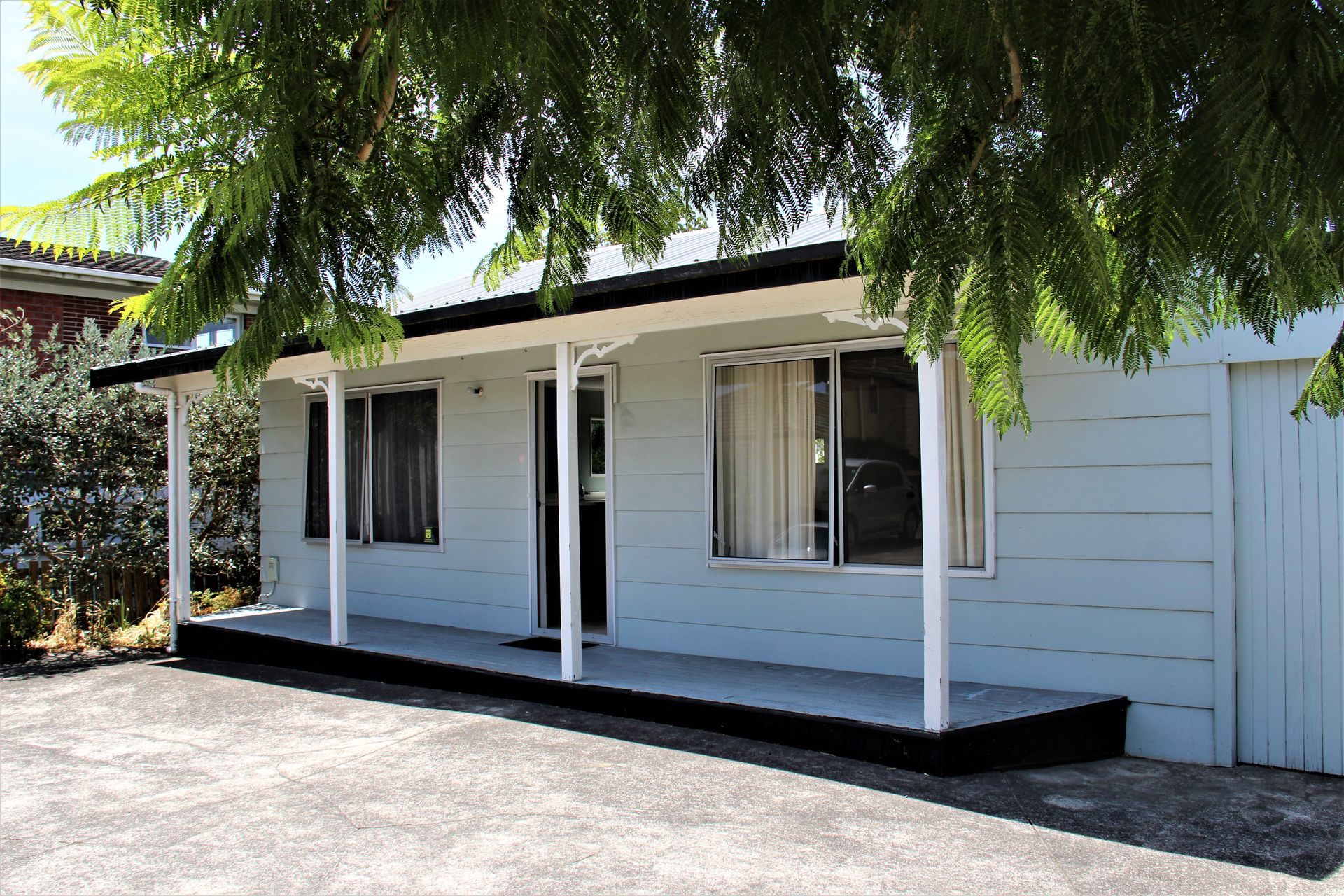 Coastal Cottage, a white weatherboard holiday home in Matua, Tauranga