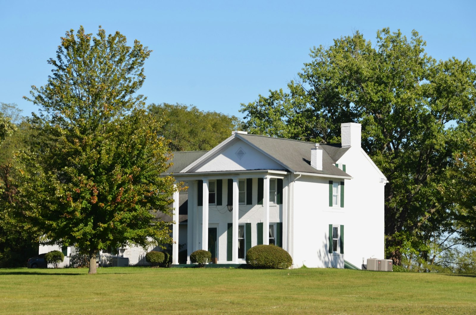 A white colonial-style house with columns